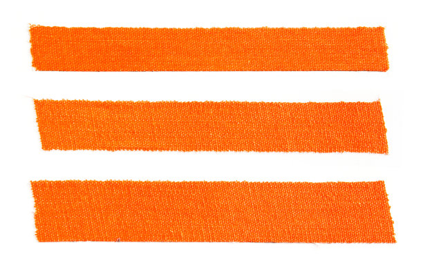 三件橙色哑光布格夫胶带孤立的白色背景。图片下载