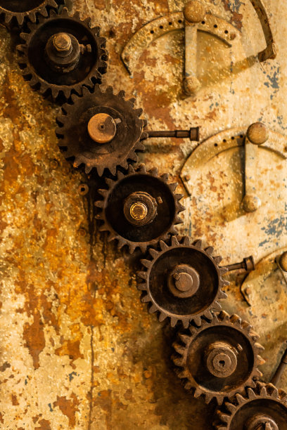 陈旧的铁腐蚀齿轮和古老的墙壁图片下载