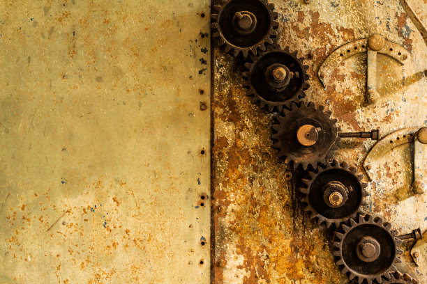 陈旧的铁腐蚀齿轮和古老的墙壁图片下载