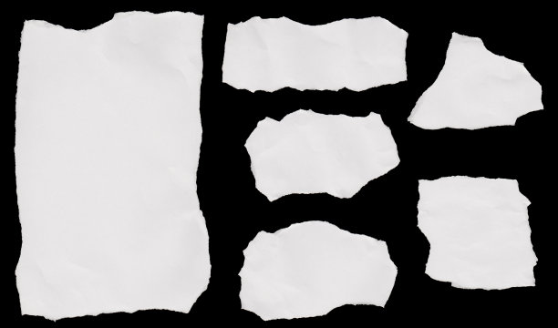 边缘撕裂的碎纸片图片下载