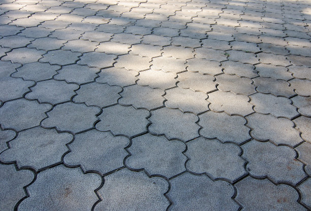 透视图的混凝土摊铺机块地坪模式为背景。图片下载