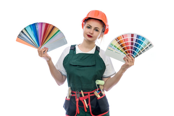 穿着工装的漂亮女人，带着工具和色卡图片下载