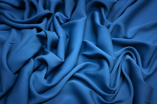 丝绸织物。颜色是灰蓝色。质地、背景、模式。图片下载