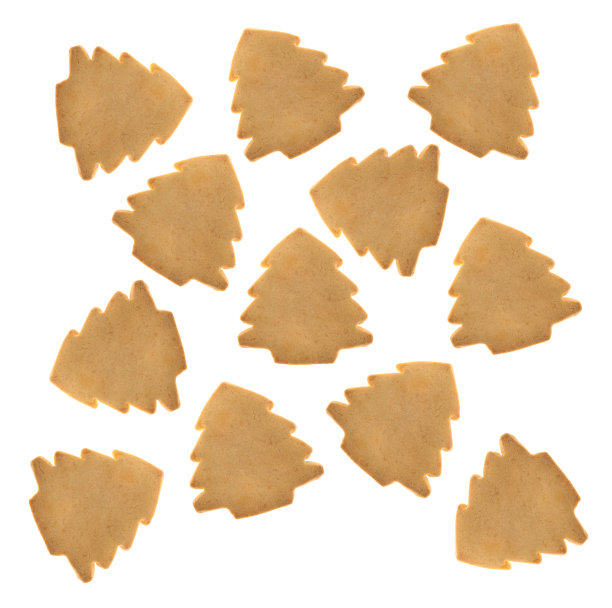 圣诞树形状的圣诞饼干在白色的背景。图片下载