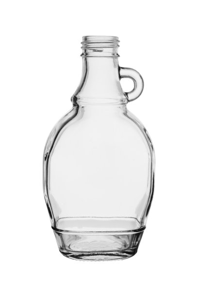 倒空小玻璃瓶，把手侧向。孤立在白色背景上图片下载