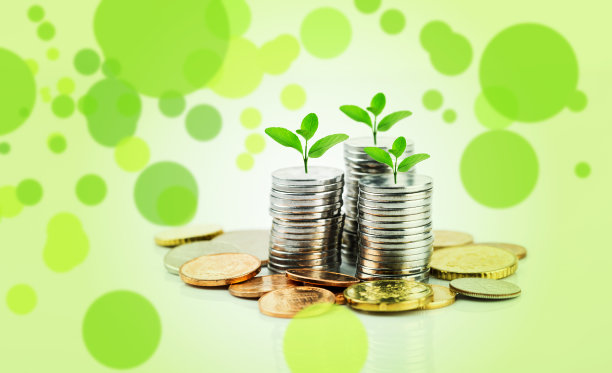 业务增长的概念。堆硬币和幼小的植物概念成长。图片下载