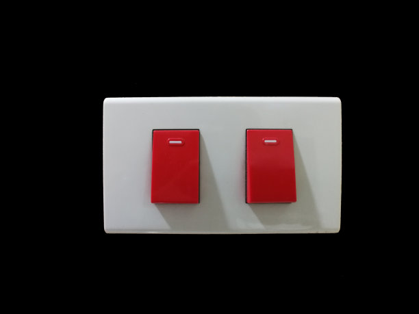 Retrotouch应急灯开关隔离，红色医院级与黑色背景图片下载