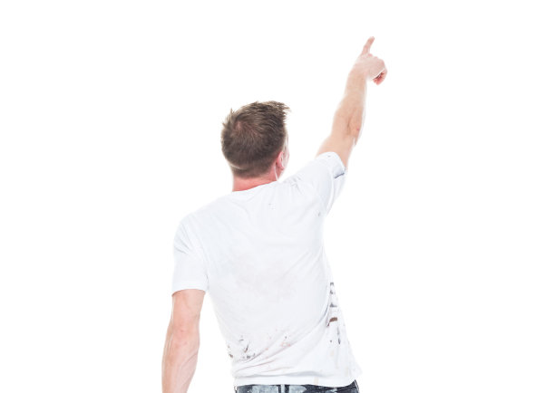 年轻的男性画家，在白色的背景上有污点的衣服-背影，指向/触摸图片下载