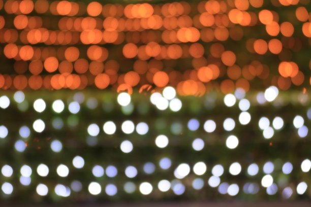 彩色散景金灯夜墙背景两种色调，金色与自然背景模糊散景明亮，佛光形成烛光模糊，质感照明图片下载