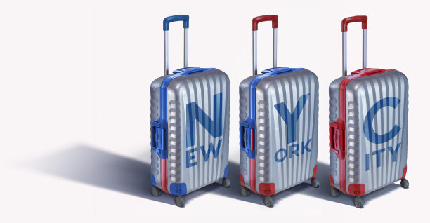 手提箱排成一行，字纽约市孤立在白色上图片下载