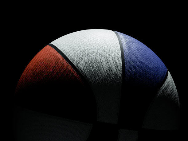 红色和蓝色的美国篮球与戏剧性的照明在黑色的背景图片下载