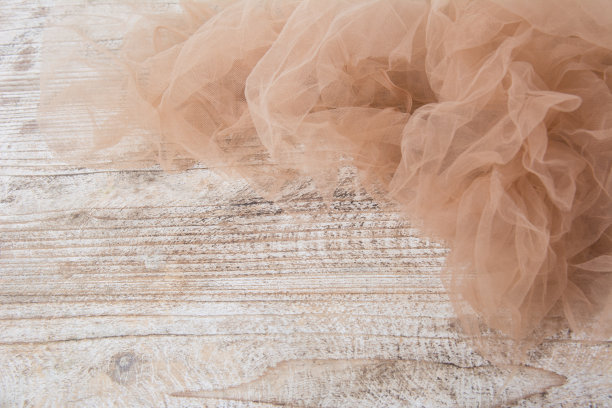 轻量级织物网状花边纹理木桌。这种织物的纹理褶皱得很漂亮图片下载