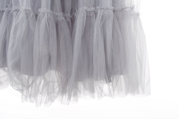 轻量织物网状花边在白色的背景。这种织物的纹理褶皱得很漂亮图片下载