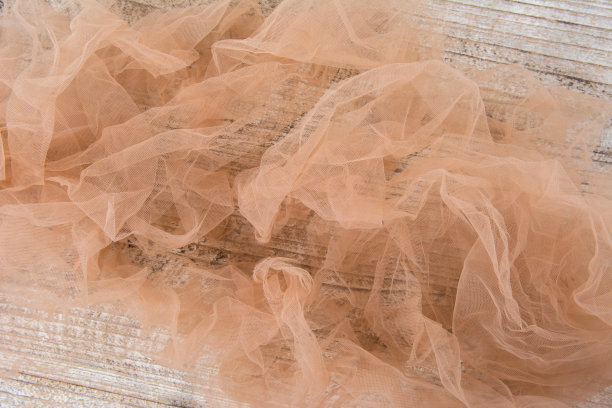 轻量级织物网状花边纹理木桌。这种织物的纹理褶皱得很漂亮图片下载