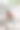可爱的小女孩坐在公园的沥青上用粉笔画画。素材图片