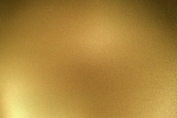 灯光照射在暗室的金色金属板上，抽象的纹理背景图片下载
