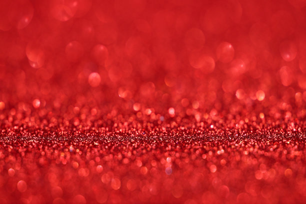 红色闪光纹理圣诞节抽象背景，散焦抽象红色闪光纹理背景图片下载