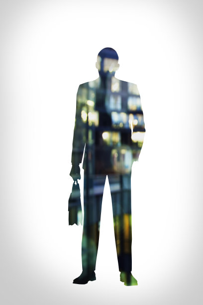 带着公文包的商人剪影在夜晚双重暴露在城市中图片下载