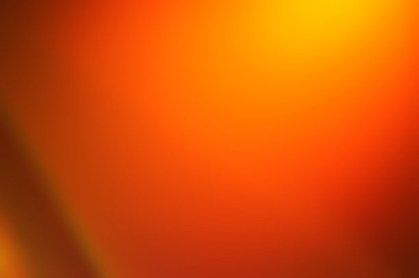 照片图像模糊抽象的彩色灯光的夜晚背景。夏季背景或温暖，热的颜色抽象的黄色，橙色，彩色墙纸与太阳和火。图片下载