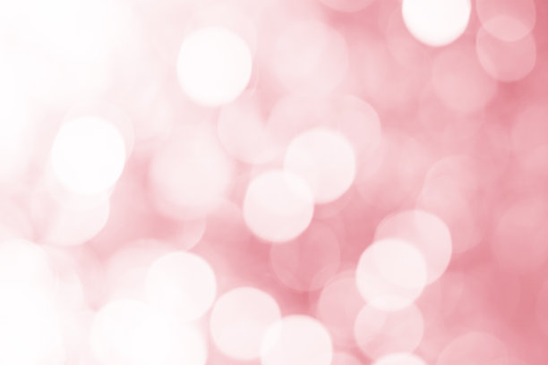 模糊抽象背景的散景效果在粉红色。模糊的光在复古色调。模糊的红色散景圈圣诞:柔焦点梦的自然。离焦闪亮的气泡灯墙纸。图片下载