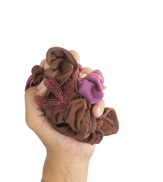 一个男人的手正在偷一个女人的内裤在白色的背景。图片下载