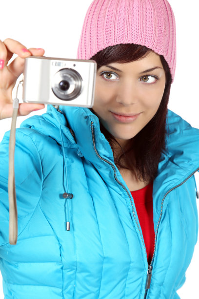 美丽的年轻女子拍照的相机，孤立在白色的背景图片下载