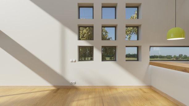 在一个空房子里，厨房柜台旁边有壁龛的窗户图片下载