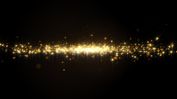 金色的粉末状色彩在黑暗中扩散出溪流的效果。图片下载