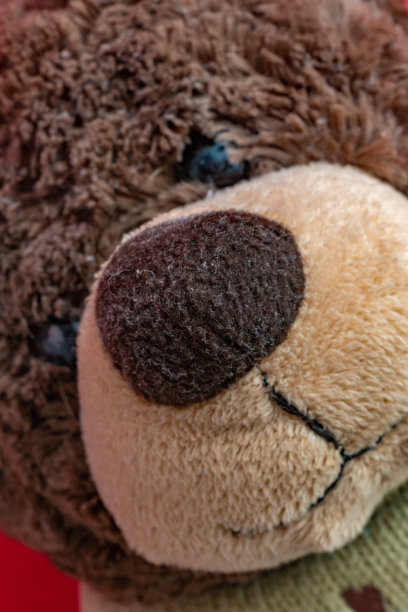 近距离的泰迪熊玩具的宏观细节的孩子图片下载