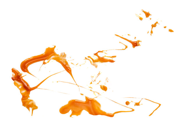 焦糖酱孤立。抽象的焦糖液体溅在一个白色的背景近距离。抽象的甜食概念。“n图片下载