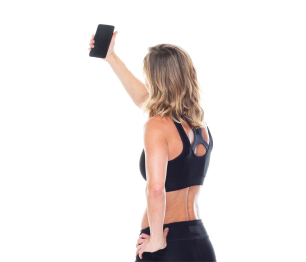 漂亮的女性在运动服装-拍照图片下载