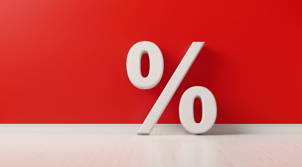 红墙前的百分比标志-销售概念图片下载