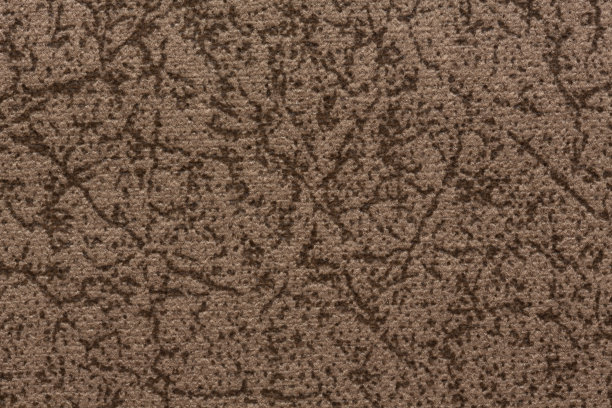令人敬畏的棕色斑驳的织物纹理近距离。图片下载