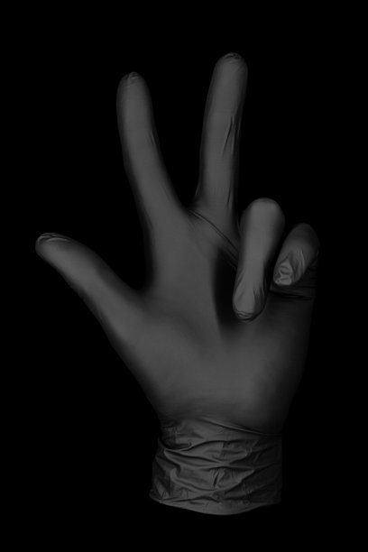 黑色背景上的黑色手套图片下载