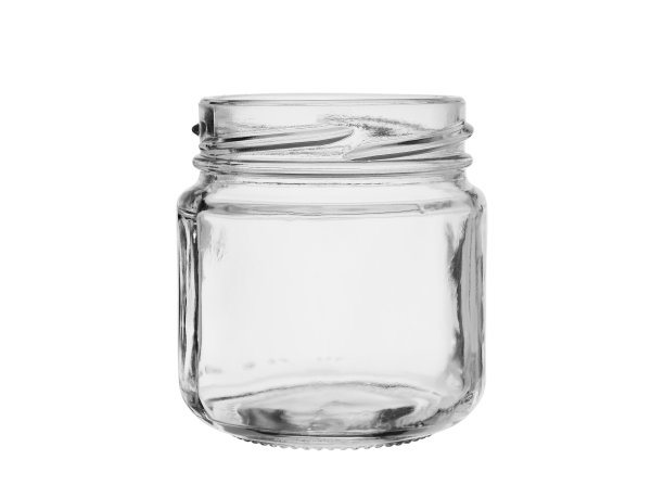 装罐头食品或果酱的空玻璃罐，没有盖子。孤立在白色背景上图片下载