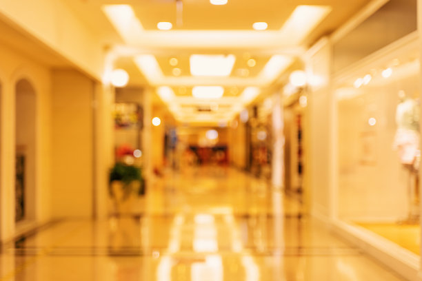 豪华百货商场的室内设计，抽象散焦模糊与散景背景，购物季节的概念设计。图片下载