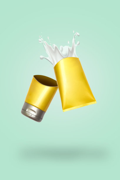 美容化妆品黄管;品牌模拟孤立的绿色背景。护手霜或磨砂膏的包装。美容彩妆管，品牌化模拟起来图片下载