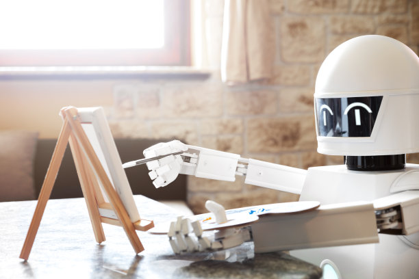 人工智能机器人是通过使用调色板学习创造力，做艺术品，概念自主机器人将成为一名艺术家图片下载