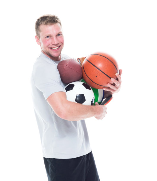 帅哥抱着各种各样的运动球图片下载