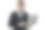 帅气的年轻人穿着正装使用笔记本电脑工作，而站在灰色背景图片下载