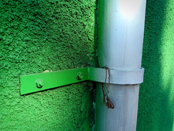 粗糙的绿色墙壁和水管的纹理图片下载