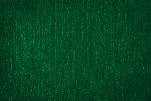 抽象纹理粗糙的深绿色纸张背景和文本复制空间。宏观纤维纸。图片下载