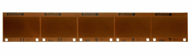 真实处理的APS胶片乳剂(24毫米)与空或空白框架，先进的摄影系统胶片材料上的白色背景，磁带与信息交换图片下载