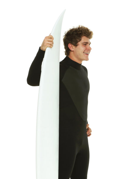 一名男子仅/腰部以上/侧视图/侧面视图20-29岁的成年英俊的人白人男性/年轻男子在白色背景下穿着潜水服/泳装谁是兴奋/快乐/微笑/成功/呼喊和庆祝图片下载