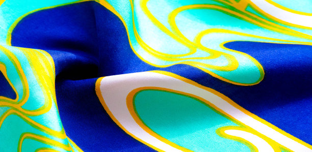 丝绸抽象的织物。这种豪华的真丝雪纺织物是引人注目的。它是透明的，有一个液体悬垂，非常柔软。理想的项目。颜色包括绿色、黄色、白色和蓝色图片下载