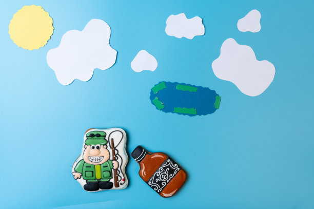 渔夫拿着钓竿和一瓶酒。图片下载