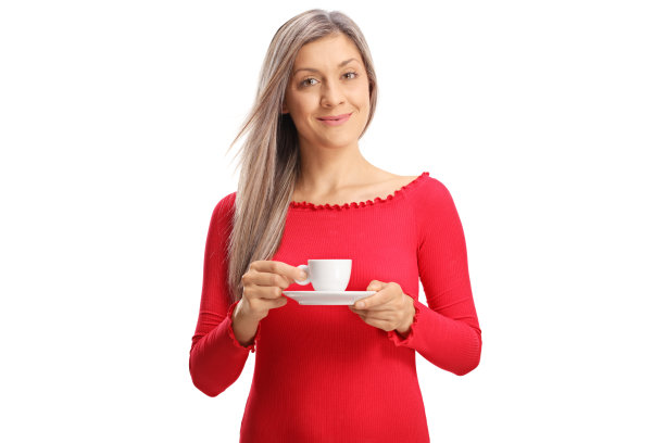 年轻的金发女人，喝着浓咖啡图片下载