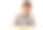 可爱的小男孩拿着书坐在书桌前。七岁的孩子图片下载