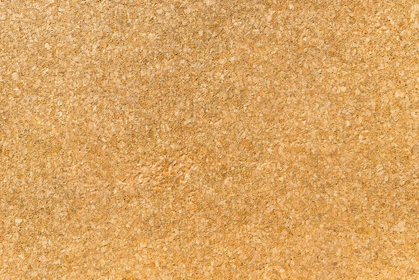 纹理从一个黄褐色的软木背景，近距离拍摄。图片下载