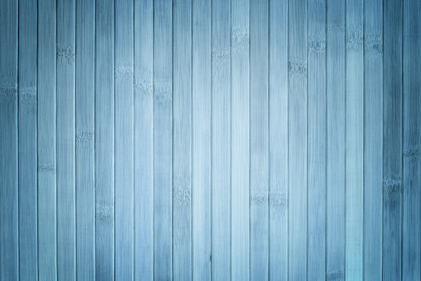 浅蓝色木质背景纹理。竹，木材背景与vignette。图片下载